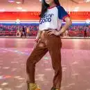 standing woman using roller skates inside building