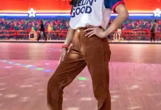 standing woman using roller skates inside building