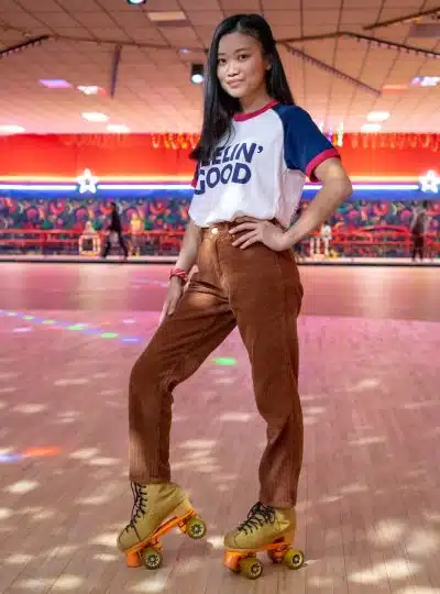 standing woman using roller skates inside building