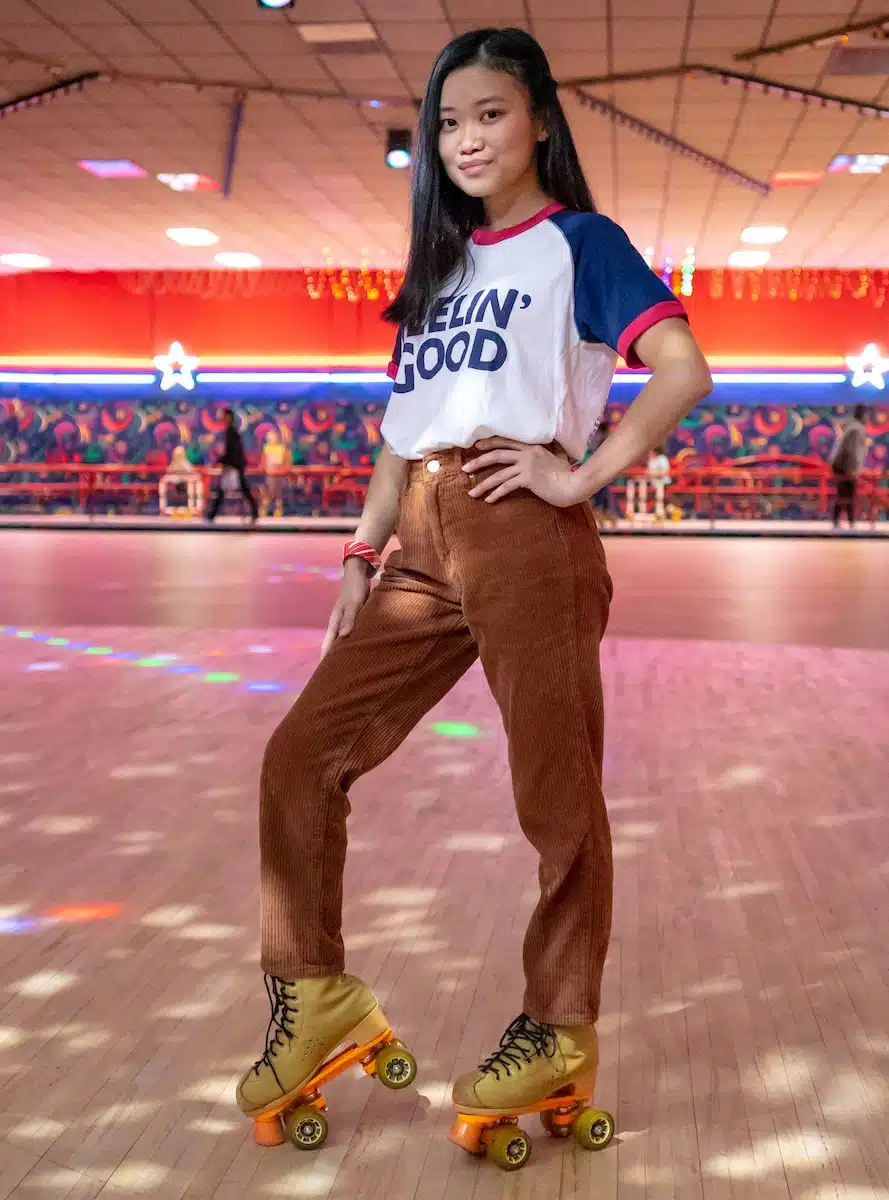 standing woman using roller skates inside building
