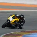 man riding yellow sportbike