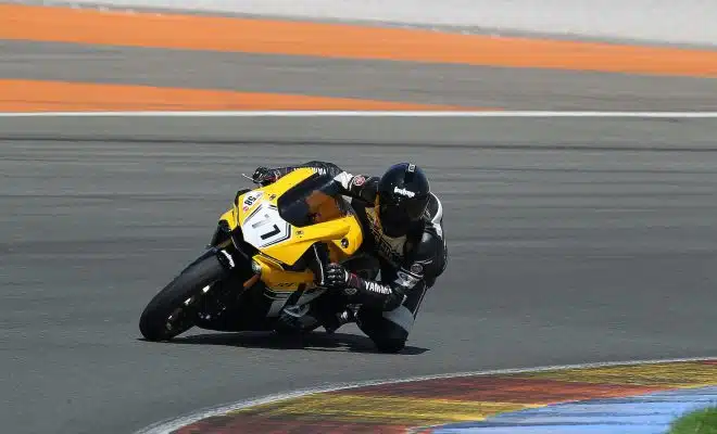 man riding yellow sportbike